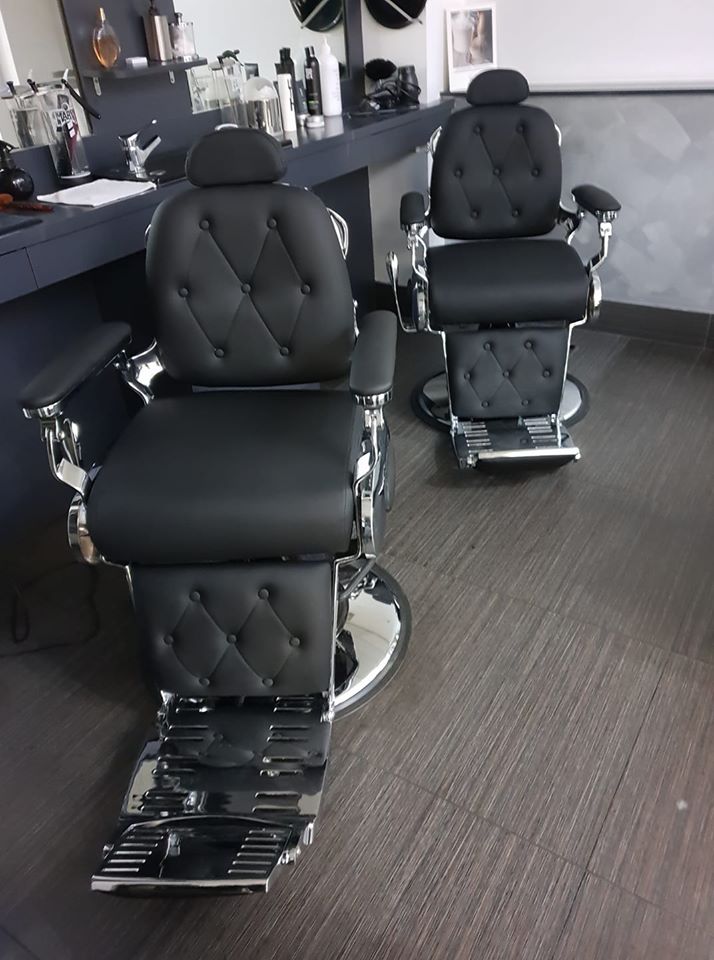 nicely fitted out Traditional Barber Shop located at 144 Adelaide Street, Brisbane City, Featuring modern barber chairs, hair product and mirrors
