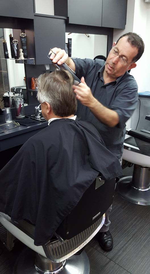 Owner Joe Micale expert Barber finishing off another great hair style for one of his regular customers at The Barber Shop in Brisbane City