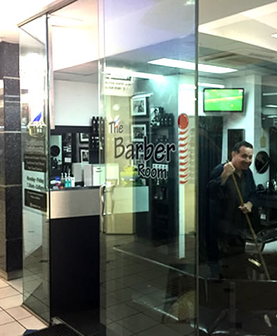 Owner Joe Micale pictured here cleaning up at days end at the Barber shop in Blocksidge Arcade, Brisbane City, home of 'The Barber Room'