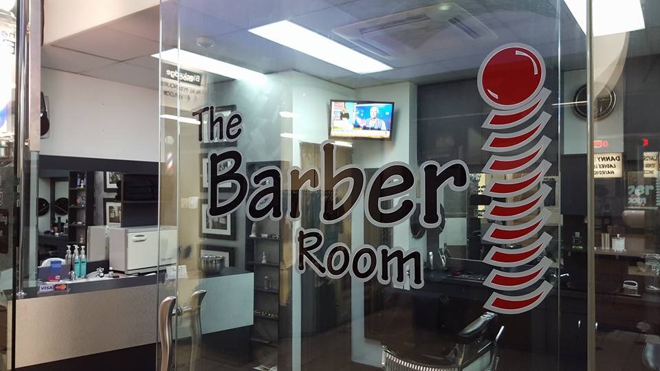 the Barber room, traditional Barber shop front with our bright logo and well equipped shop ready for tomorrows customers
